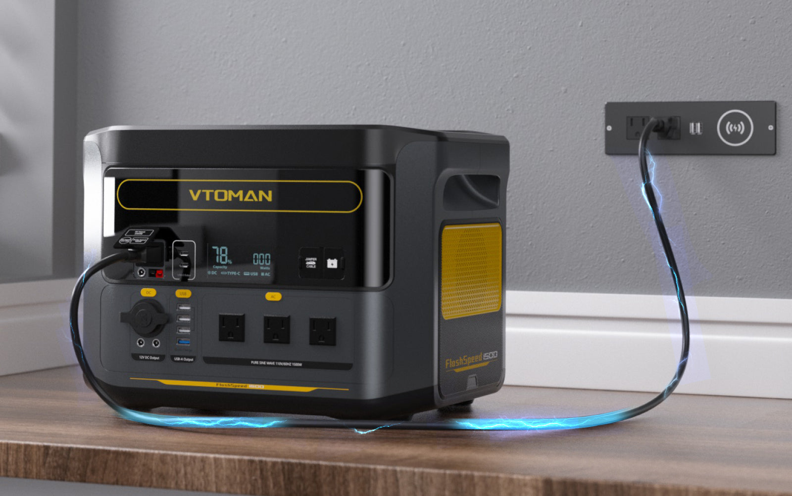 A VTOMAN portable power station on a wooden surface, plugged into a wall outlet.